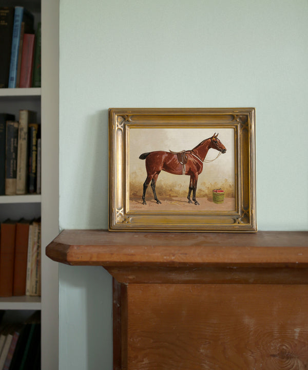 Vintage bay horse painting in a gold frame