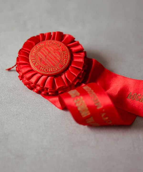 slideimg The rosette is foil stamped with a gold monogram and delicate linework on a satin covered button.