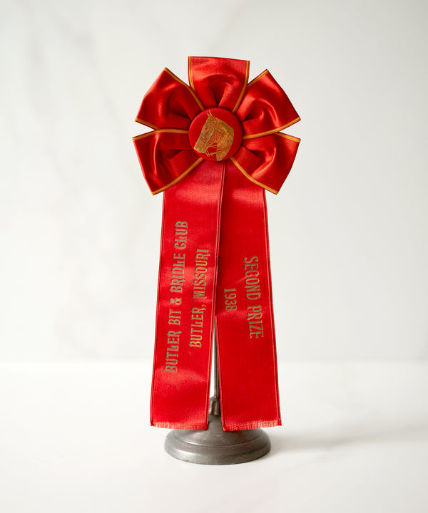 slideimg The satin button is foil stamped with an incredibly detailed illustration.