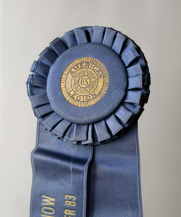 slideimg The rosette is foil stamped with a gold monogram and delicate linework on a satin covered button.